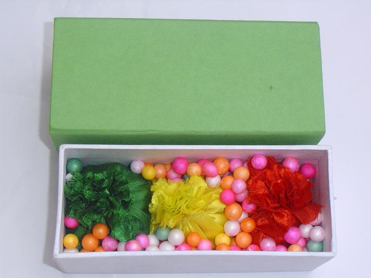 Holi gift packet with color balls.